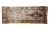 Distressed Oushak runner, dusty blush and brown medallion, muted floral patterns, and worn texture.