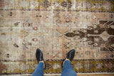 Distressed vintage Oushak runner with nuanced floral motifs in dusty blush and olive green.