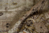 Distressed pile and nuanced floral motifs of a vintage Oushak runner in muted dusty tones.