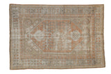 Distressed Oushak rug, triple medallion with botanical designs, geometric border in muted peach and beige.