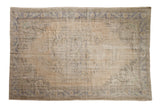 Hand-knotted distressed Oushak carpet, cream and blue, with shadow floral medallion, 6'5