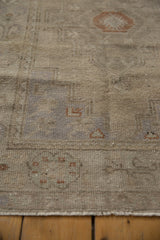 Distressed vintage Oushak runner pile with even wear to knot heads, faint foundation showing.