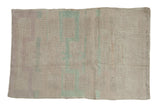 Vintage distressed Turkish Tulu rug with a tiered plant design in dusty blue and mauve.