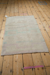 The back of the vintage Tulu rug, showing the hand-knotted weave and secured edges.