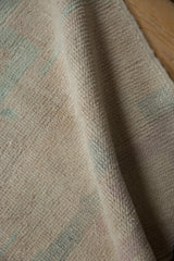 Detailed view of the hand-knotted pile and even wear on a vintage Turkish Tulu rug.