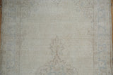 Distressed vintage Sparta rug pile featuring foundation wear and faded traditional motifs.
