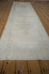 Distressed Sparta runner detail, showing wear to foundation, faint Rococo palmette motif.