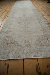 Textured pile of the distressed vintage Sparta runner with faded palmette design in neutral tones.