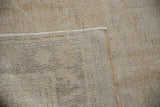 Back view of a vintage Oushak carpet showing the secure hand-knotted foundation and corner.