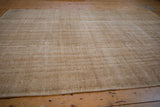 Vintage Distressed Oushak rug texture with worn, subtle patterns in beige and light tones.