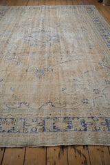 Worn pile and visible foundation on a vintage distressed Oushak rug.