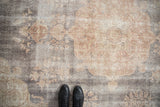 Distressed vintage Sparta carpet featuring visible wear, softened floral patterns, and faded colors.
