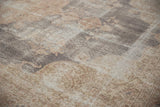 Close-up of the distressed vintage Sparta carpet, revealing worn pile and visible foundation.