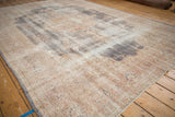 Vintage Distressed Sparta carpet showing heavy pile wear, faded ivory, mauve, and slate blue motifs.