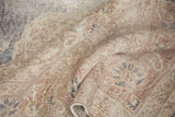 Textured, distressed pile of vintage Sparta carpet with faded ivory, brown, and mauve motifs.