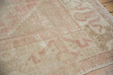 Vintage Distressed Oushak carpet with worn low pile, soft dusty rose and ivory design.