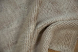 Distressed Tulu runner texture showing high-pile, subtle ivory, platinum, and mauve tones.