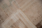Hand-knotted foundation and distressed beige pile on a vintage Turkish Oushak carpet corner.