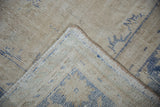 The reverse side of a vintage Oushak carpet, showing the detailed hand-knotted foundation weave.