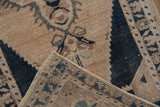Oushak rug with folded corner revealing original side selvedge and tightly woven foundation.