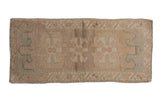 Distressed Oushak rug runner with faded floral guls in ivory, beige, and seafoam green.