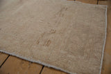 Reverse view showing the dense hand-knotted foundation and secured selvage of an Oushak rug.