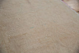 The reverse side of a vintage hand-knotted rug showing its foundation weave.