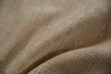 Distressed vintage Oushak rug's antique ivory pile showing even wear and abrashes.