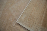 Vintage Oushak rug's tightly woven reverse and intact ivory side cord selvage.