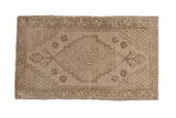 Vintage distressed Oushak rug mat with stepped medallion and muted beige patterns. 1'8
