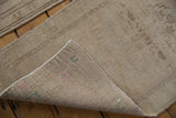 The hand-knotted foundation and original side cord selvage on the back of a vintage Oushak rug.