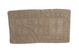 Distressed vintage Oushak rug mat with faded beige floral medallion and seafoam accents, 1'8