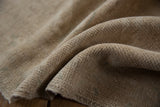 Hand-knotted beige backing of the distressed Oushak rug with soft green undertones.