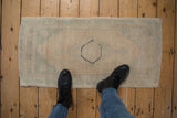 Distressed Oushak rug runner with faded antique ivory and seafoam green hues.
