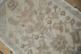 Texture of a distressed Oushak rug mat showing even wear down to the knot heads.