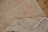 Hand-knotted Oushak runner reverse, showing original side cord selvages and red numbers.