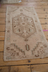 Central floral motif with expressive leaves, dusty blush, faded mint, and chocolate brown.