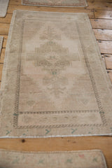 Intact original side cord selvages on a distressed vintage Oushak rug.