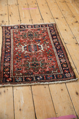 Vintage Persian Karaja rug displaying geometric medallion, floral field, and starburst border.