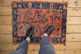 Persian Lilihan rug's dusty blush tree of life motif with cobalt blue palmette border.