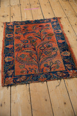 Dusty blush field and cobalt blue floral arabesque border of the vintage Lilihan rug.