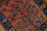 Lilihan rug's dusty blush field showing tree of life, cobalt blue vines, coffee brown leaves.