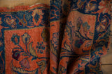Hand knotted Lilihan rug detail showcasing dusty blush, cobalt blue floral arabesques, and textured pile.