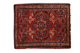 Hand-knotted Persian Sarouk rug with rich red field, indigo, ivory thousand flower sprays.