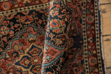 Hand-knotted Josan Sarouk pile displaying intricate navy, raspberry, and ivory floral vinery.