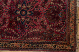 Vintage American Sarouk rug corner with thousand flower motif, cherry red, navy, and intact selvage.