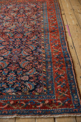 Kurdish Hamadan rug showing the dense Herati pattern field and red meandering vine border.
