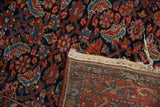 Vintage Hamadan rug's navy, red Herati pattern and hand-knotted foundation with intact selvage.