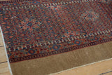 Persian Serab runner's secure camel side, with intricate floral blossoms.