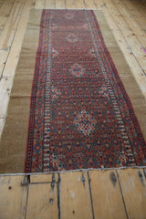 Scalloped cherry red and sky blue medallions, lattice vinery on a vintage Serab rug runner.